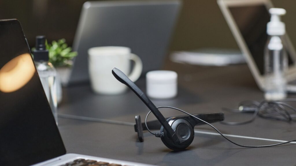 Headset with microphone on a desk for online accent coaching