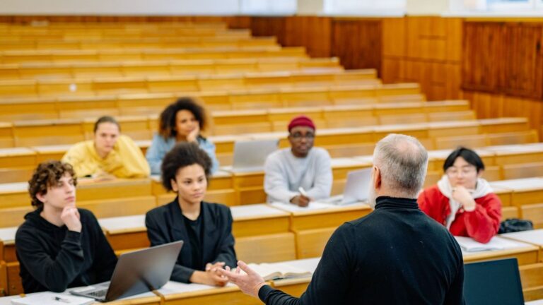 Professor teaching students in a lecture hall