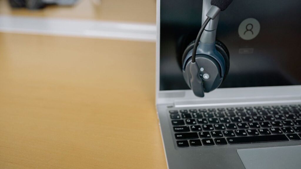 Headset on a laptop for online 1-on-1 American accent training
